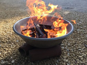 fire burning in a metal bowl