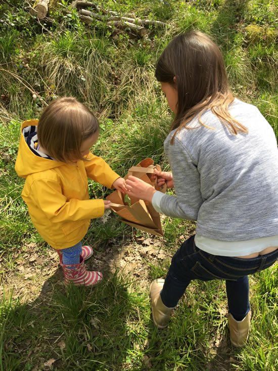 two people whittling wood