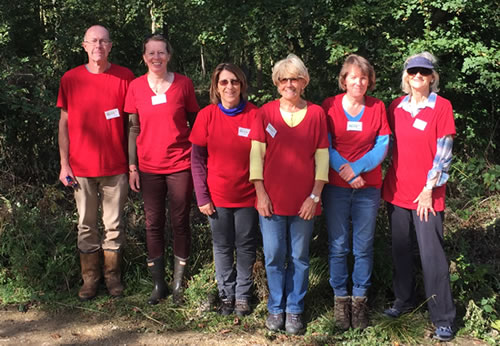 6 people standing in a row