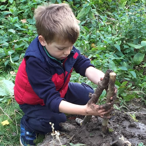 boy playing with mud
