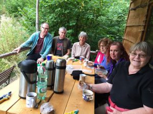 group of adults sitting at a table