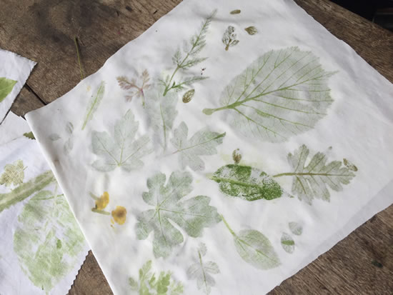 two people sawing wood