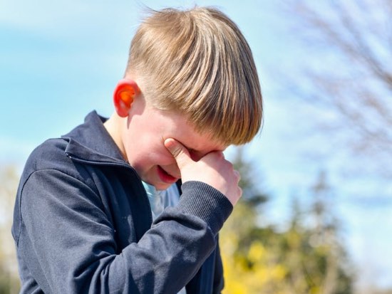 young boy crying